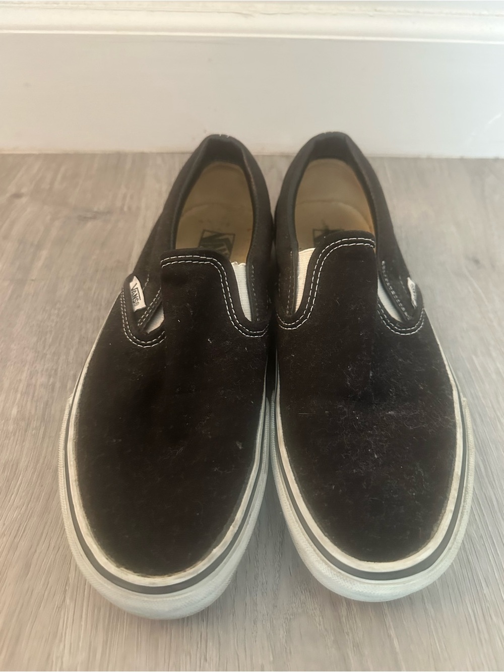 Vans Slip-On Sneakers in Black with White Trim